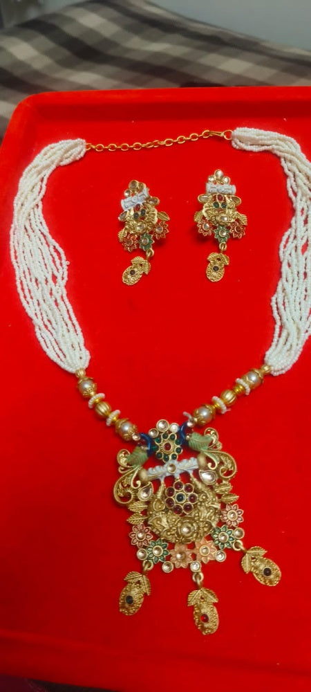 Kalyani | Antique Gold Multi-Strand Pearl Mala & Enameled Peacock Temple Pendant Set