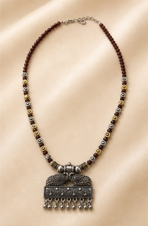 Oxidized Dual-Tone Maroon Crystal Bead Necklace with Tribal Peacock Pendant