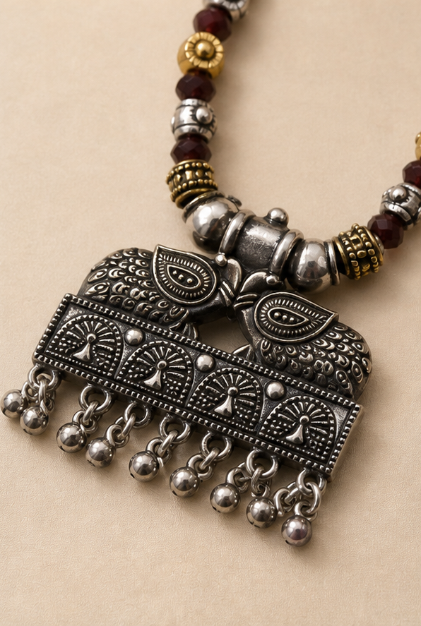 Oxidized Dual-Tone Maroon Crystal Bead Necklace with Tribal Peacock Pendant
